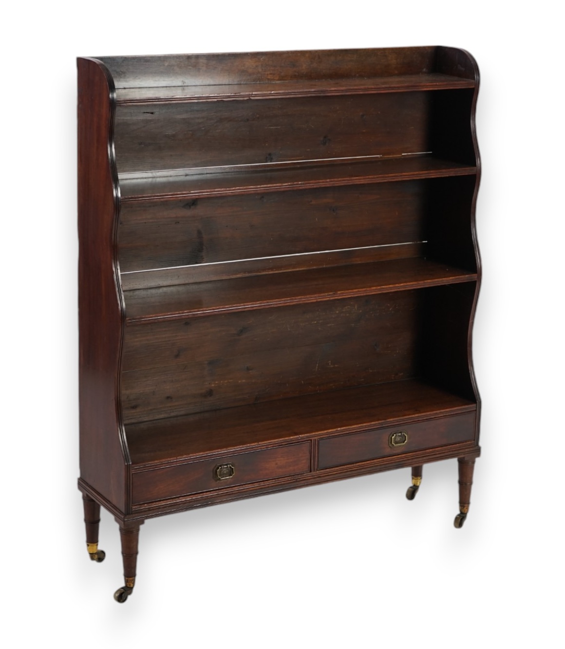 An early 19th century mahogany waterfall bookcase